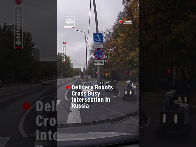Delivery Robots Cross  Busy Intersection in  Russia