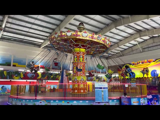 Carnival Ride at indoor amusement park  | Royalty free stock video footage - No copyright clips | 4K