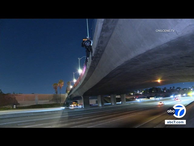 Corvette hangs from 5 Fwy overpass after Anaheim crash