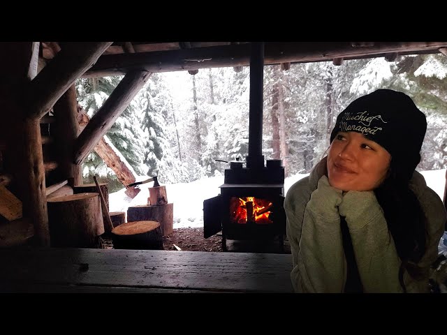 snowstorm camping alone in a hut