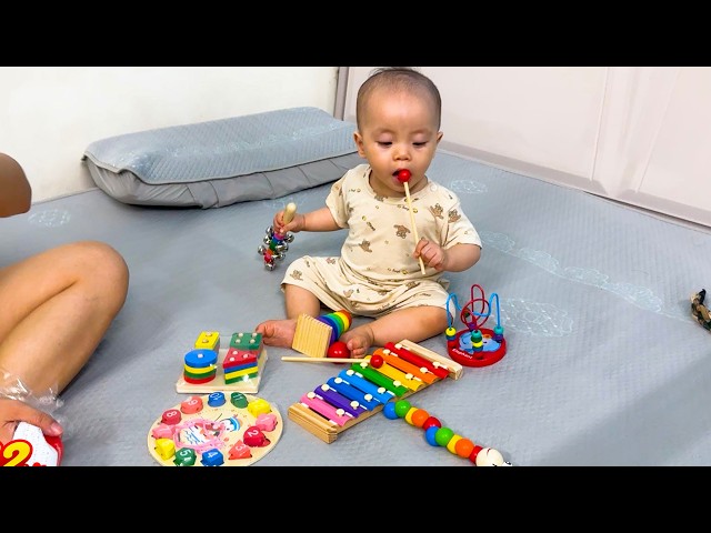 Baby Kim is delighted with the educational toys Mom bought for her