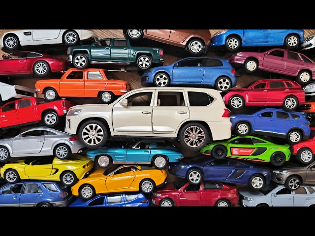 Big White SUV Among Large Number of Toy Cars
