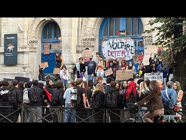 French protests over school conditions spread as students set fires and put up blockades