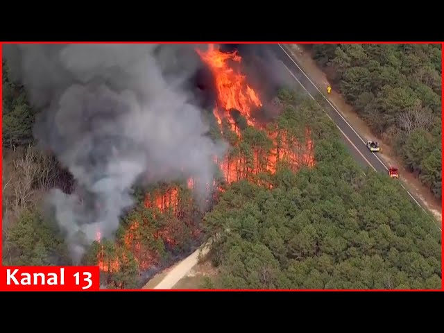 Aerial video of wildfire spreading across New Jersey forest