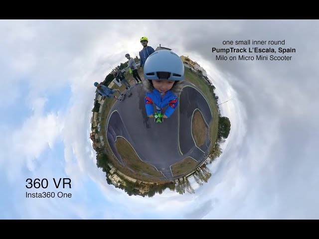 Milo with Micro Mini scooter doing one 360 VR small inner round on PumpTrack L'Escala