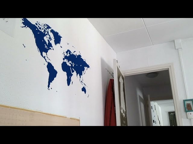 Painting a World map on a room wall. Super-fast video!