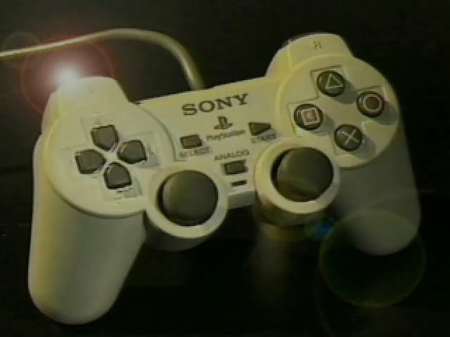 The Big Show showing off the Dual Shock Controller on the PlayStation