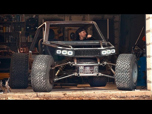 A man is building a unique all-terrain vehicle in a garage!