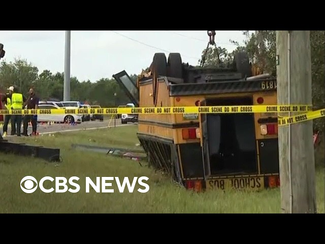 School bus flips over in crash, killing 2, including a student