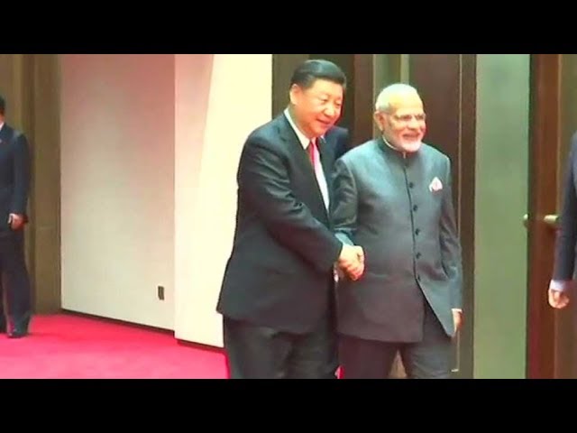 China's Xi Jinping greets PM Narendra Modi with a handshake and smile ahead of SCO Summit