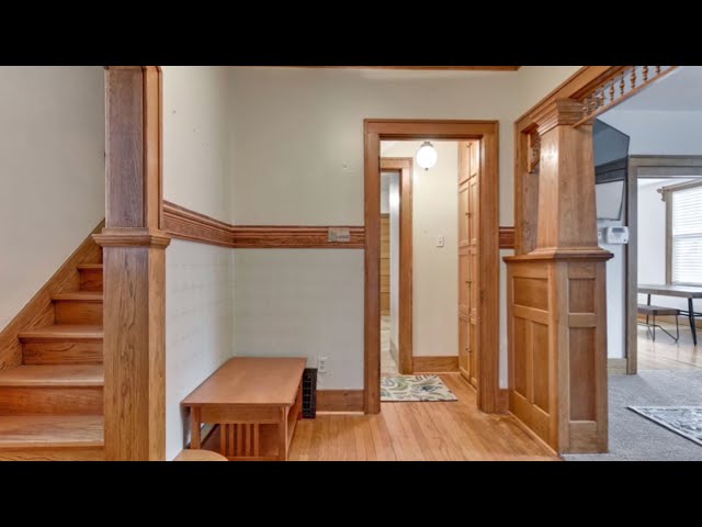 Beautiful 4 bedroom all brick home features Original woodwork, 2 car garage and storage galore!