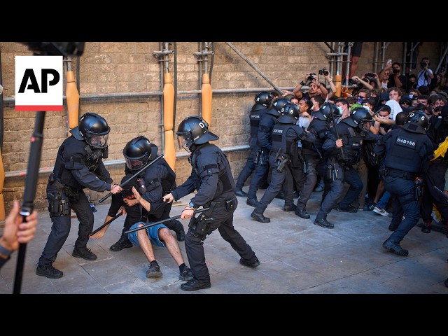 Protesters clash with police in Barcelona during the region’s national day