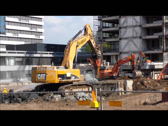 Caterpillar 390D with hydraulic hammer busting concrete at the RUB --- AWR Abbruch