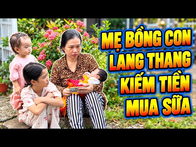 Mẹ bồng con lang thang kiếm tiền mua sữa
