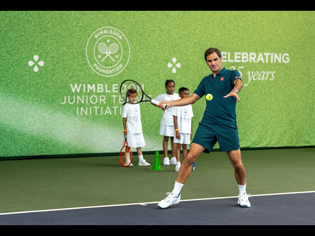 Roger Federer giving a tennis lesson