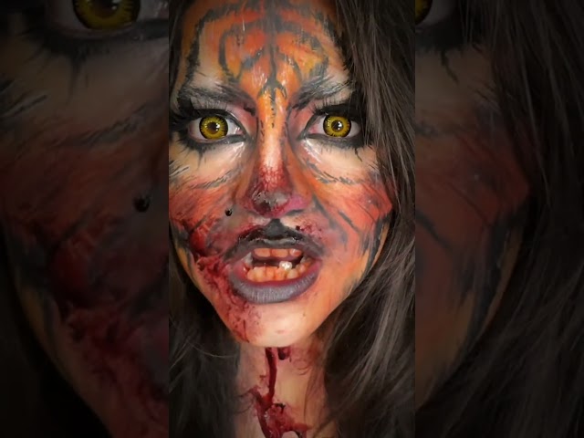 She bites 🐅 follow & like for tutorial #tigermakeup #makeuptrends #tigercat #halloweenmakeup