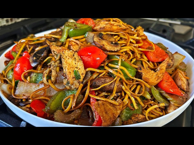 At home Caribbean Chinese Noodles with Chicken and Vegetables Stir Fry