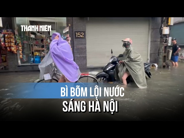 Wading Through Heavily Flooded Hanoi Streets Amidst Floating Trash