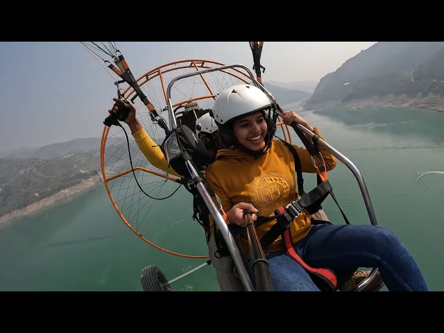 Acrobatic moves on a tandem paramotor ride powered Paragliding flying at Tehri lake Dam Uttrakhand 