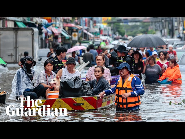 Bangkok residents navigate streets by boat as flood waters rise