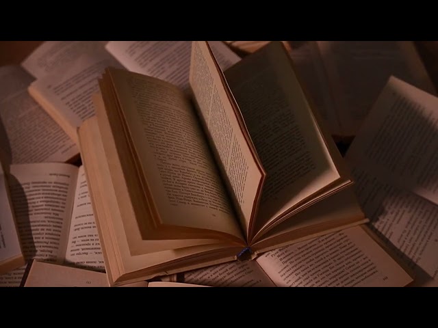4K Free Stock Footage – Open Book Pages Turning in Warm Light | Cozy Reading & Literature Scene