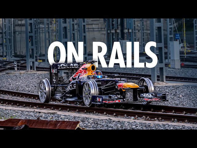 Driving a Formula 1 Car on Train Tracks